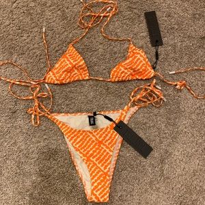 Triangl, orange & white unworn bathing suit